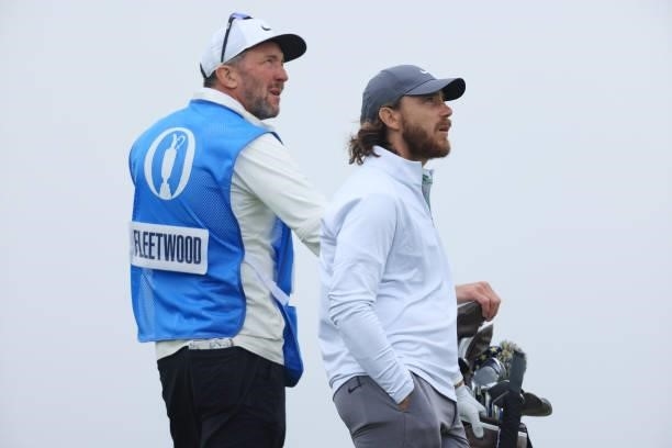 Tommy Fleetwood of England and caddie look on during a practice round for The 149th Open at Royal St George’s Golf Club on July 12, 2021 in Sandwich,...