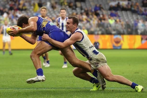 Jack Mahony of the Kangaroos tackles Andrew Gaff of the Eagles during the round 17 AFL match between the West Coast Eagles and North Melbourne...