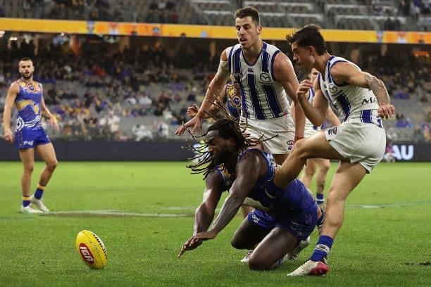 Nic Naitanui of the Eagles smothers the kick of Jy Simpkin of the Kangaroos in action during the round 17 AFL match between the West Coast Eagles and...