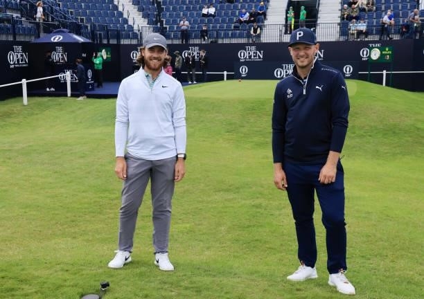 Tommy Fleetwood and Sam Forgan of England look on during a practice round for The 149th Open at Royal St George’s Golf Club on July 12, 2021 in...