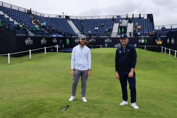 Tommy Fleetwood and Sam Forgan of England look on during a practice round for The 149th Open at Royal St George’s Golf Club on July 12, 2021 in...
