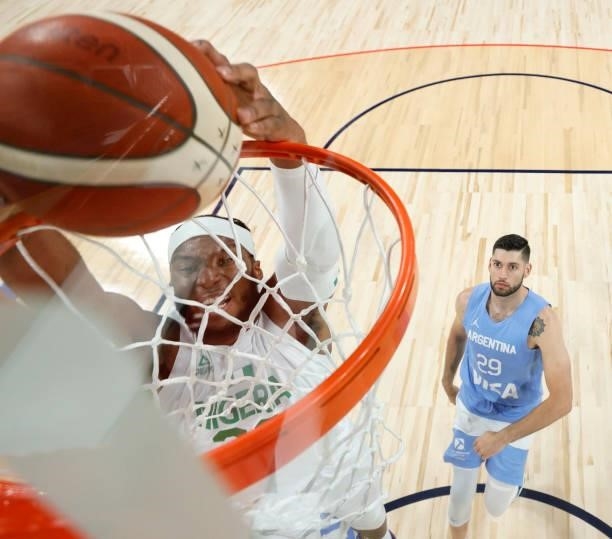 Josh Okogie of Nigeria dunks ahead of Patricio Garino of Argentina during an exhibition game at Michelob ULTRA Arena ahead of the Tokyo Olympic Games...