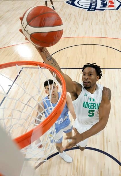 Stanley Okoye of Nigeria drives to the basket against Gabriel Deck of Argentina during an exhibition game at Michelob ULTRA Arena ahead of the Tokyo...