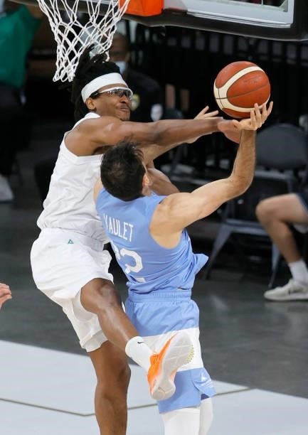 Chima Moneke of Nigeria blocks a shot by Juan Pablo Vaulet of Argentina during an exhibition game at Michelob ULTRA Arena ahead of the Tokyo Olympic...
