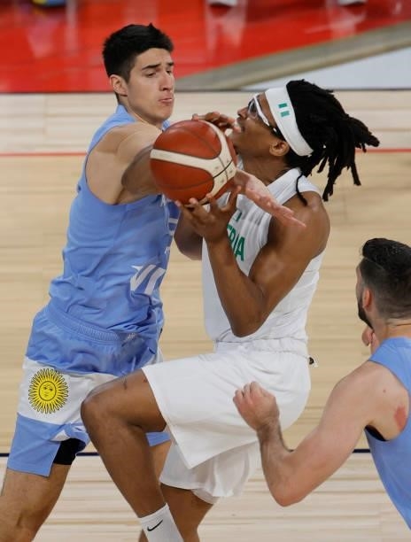 Chima Moneke of Nigeria drives to the basket against Lautaro Berra of Argentina during an exhibition game at Michelob ULTRA Arena ahead of the Tokyo...