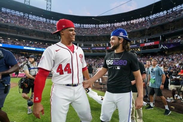 Juan Soto of the Washington Nationals talks with American League All-Star Bo Bichette of the Toronto Blue Jays during the 2021 T-Mobile Home Run...