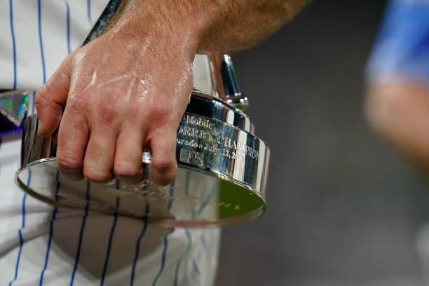 Pete Alonso of the New York Mets holds on to his trophy after winning the 2021 T-Mobile Home Run Derby at Coors Field on July 12, 2021 in Denver,...