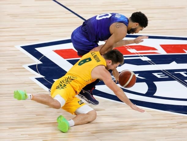 Jayson Tatum of the United States knocks the ball away from Matthew Dellavedova of the Australia Boomers during an exhibition game at Michelob Ultra...