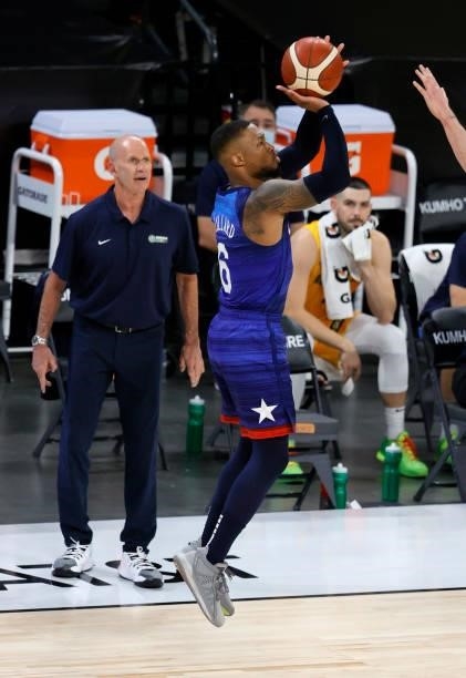 Head coach Brian Goorjian of the Australia Boomers watches Damian Lillard of the United States shoot a 3-pointer during an exhibition game at...
