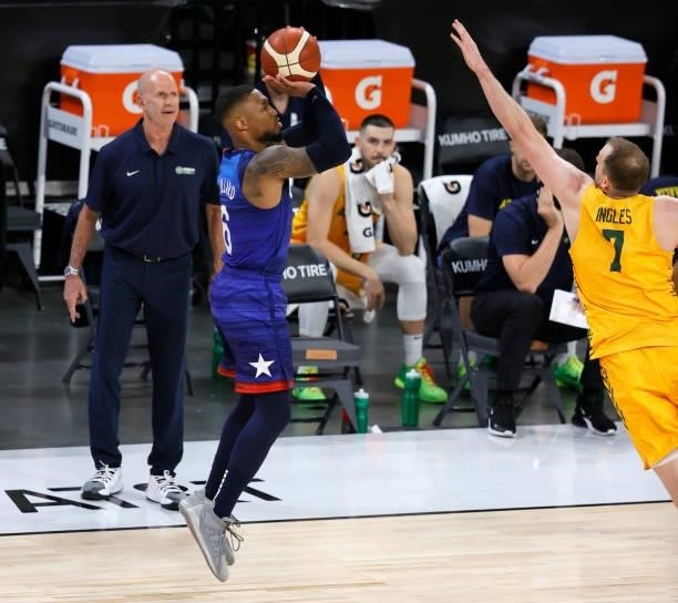 Head coach Brian Goorjian of the Australia Boomers watches Damian Lillard of the United States shoot a 3-pointer against Joe Ingles of the Boomers...