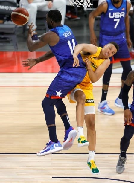 Dante Exum of the Australia Boomers loses the ball as he drives against Draymond Green of the United States during an exhibition game at Michelob...