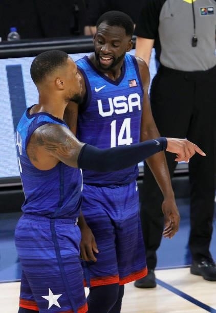 Damian Lillard and Draymond Green of the United States talk during an exhibition game against the Australia Boomers at Michelob Ultra Arena ahead of...