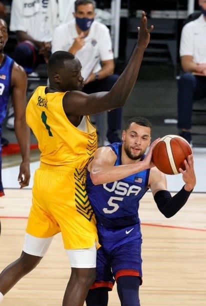 Zach LaVine of the United States passes against Duop Reath of the Australia Boomers during an exhibition game at Michelob Ultra Arena ahead of the...