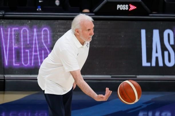 Head coach Gregg Popovich of the United States tosses the ball to an official during an exhibition game against the Australia Boomers at Michelob...
