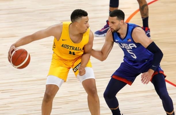 Dante Exum of the Australia Boomers is guarded by Zach LaVine of the United States during an exhibition game at Michelob Ultra Arena ahead of the...