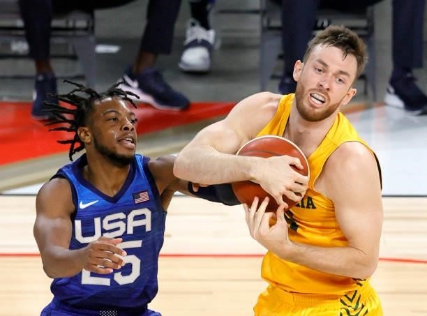 Nick Kay of the Australia Boomers grabs a rebound against Darius Garland of the United States during an exhibition game at Michelob Ultra Arena ahead...