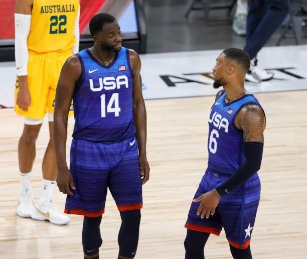Draymond Green and Damian Lillard of the United States talk during an exhibition game against the Australia Boomers at Michelob Ultra Arena ahead of...