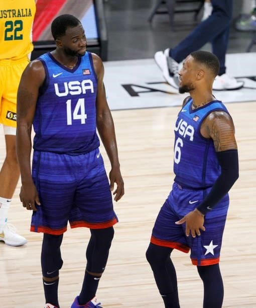Draymond Green and Damian Lillard of the United States talk during an exhibition game against the Australia Boomers at Michelob Ultra Arena ahead of...