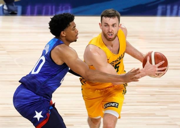 Nick Kay of the Australia Boomers is guarded by Keldon Johnson of the United States during an exhibition game at Michelob Ultra Arena ahead of the...