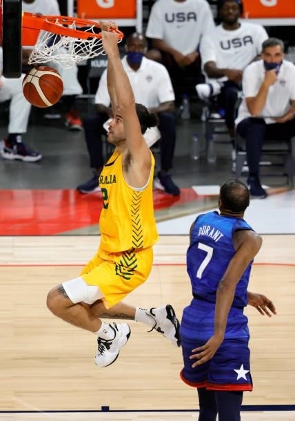 Xavier Cooks of the Australia Boomers dunks ahead of Kevin Durant of the United States during an exhibition game at Michelob Ultra Arena ahead of the...