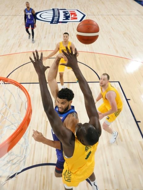Jayson Tatum of the United States passes under pressure from Duop Reath of the Australia Boomers during an exhibition game at Michelob Ultra Arena...