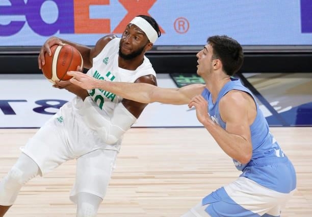 Josh Okogie of Nigeria is guarded by Maximo Fjellerup of Argentina during an exhibition game at Michelob ULTRA Arena ahead of the Tokyo Olympic Games...