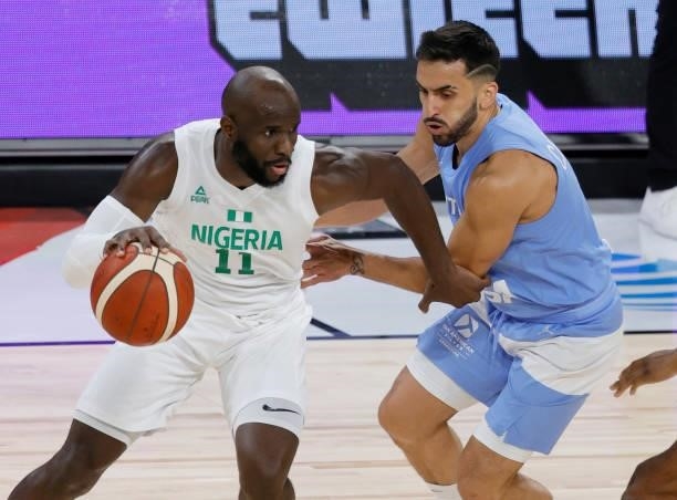 Obi Emegano of Nigeria is guarded by Facundo Campazzo of Argentina during an exhibition game at Michelob ULTRA Arena ahead of the Tokyo Olympic Games...