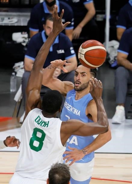 Facundo Campazzo of Argentina passes against Ekpe Udoh of Nigeria during an exhibition game at Michelob ULTRA Arena ahead of the Tokyo Olympic Games...