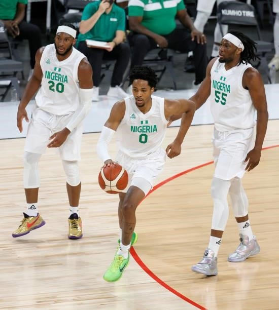 Okpala of Nigeria brings the ball up the court against Argentina ahead of teammates Josh Okogie and Precious Achiuwa during an exhibition game at...