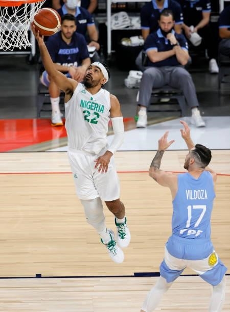 Gabe Nnamdi Vincent of Nigeria shoots a layup against Luca Vildoza of Argentina during an exhibition game at Michelob ULTRA Arena ahead of the Tokyo...