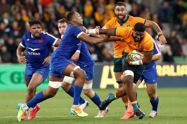 Isi Naisarani of the Wallabies fends off Cameron Woki of France during the International Test match between the Australian Wallabies and France at...