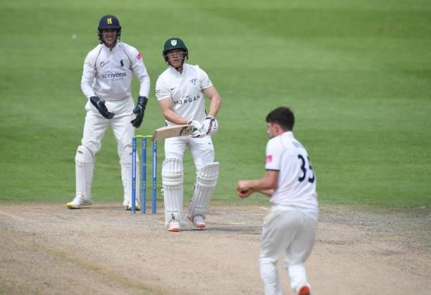 Ben Cox of Worcestershire is caught out by Will Rhodes of Warwickshire during the LV = Insurance County Championship match between Worcestershire and...
