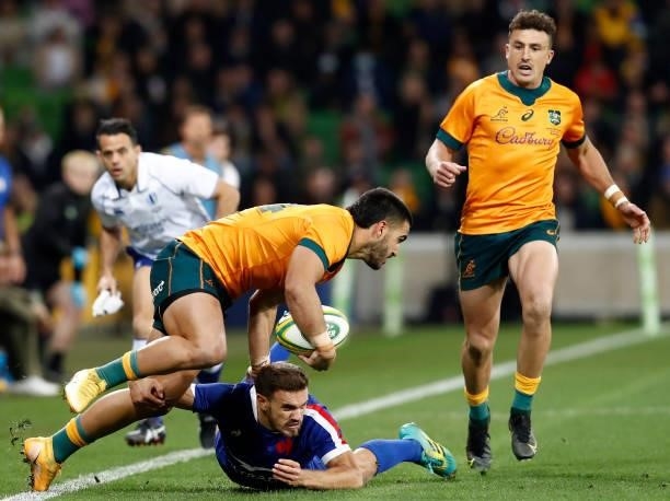 Melvyn Jaminet of France tackles Tom Wright of the Wallabies during the International Test match between the Australian Wallabies and France at AAMI...