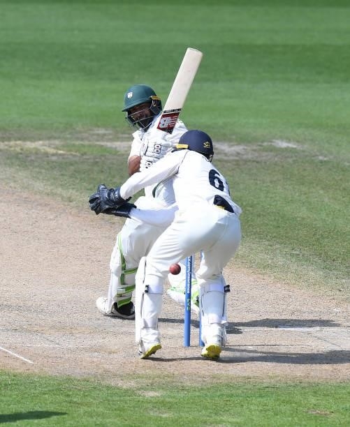 Ish Sodhi of Worcestershire hits his shot past Michael Burgess of Warwickshire during the LV = Insurance County Championship match between...