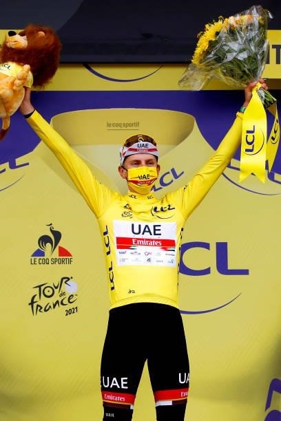 Tadej Pogačar of Slovenia and UAE-Team Emirates yellow leader jersey celebrates at podium during the 108th Tour de France 2021, Stage 16 a 169km...