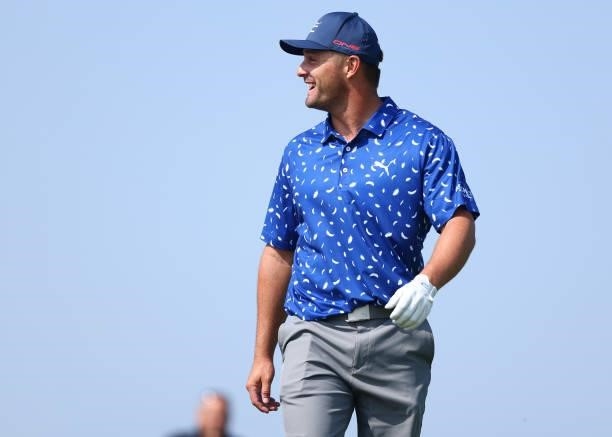 Bryson Dechambeau of The United States interacts with spectators during a practice round for The 149th Open at Royal St George’s Golf Club on July...