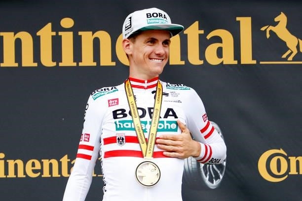 Patrick Konrad of Austria and Team BORA - Hansgrohe stage winner celebrates at podium during the 108th Tour de France 2021, Stage 16 a 169km stage...
