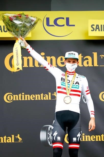 Patrick Konrad of Austria and Team BORA - Hansgrohe stage winner celebrates at podium during the 108th Tour de France 2021, Stage 16 a 169km stage...