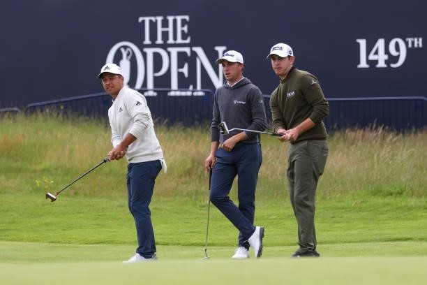 Xander Schauffele of The United States, Justin Thomas of United States and Patrick Cantlay of The United States look on during a practice round for...