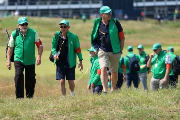 Marshalls walk on course during a practice round for The 149th Open at Royal St George’s Golf Club on July 13, 2021 in Sandwich, England.