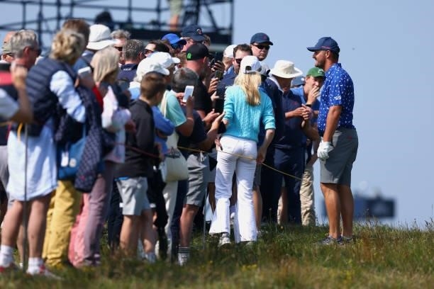 Bryson Dechambeau of The United States interacts with spectators during a practice round for The 149th Open at Royal St George’s Golf Club on July...