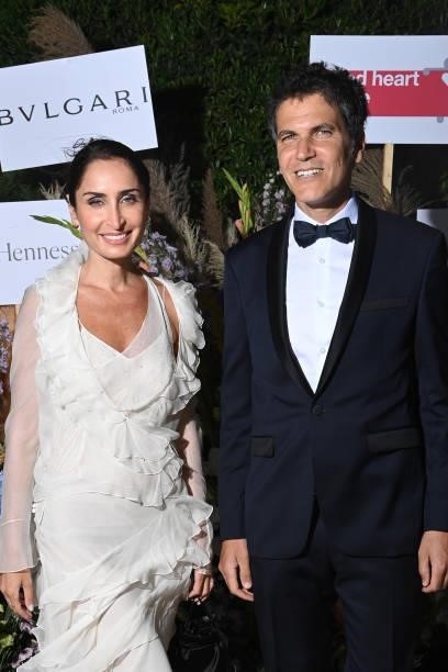 Geraldine Boublil and a guest attend the Naked Heart France Riviera Dinner 2021 during the 74th annual Cannes Film Festival on July 13, 2021 in...