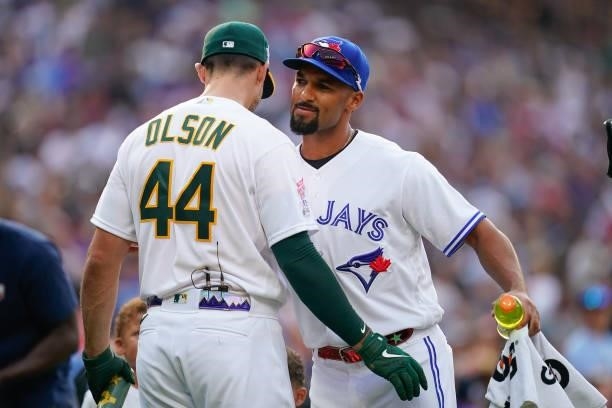 American League All-Star Marcus Semien of the Toronto Blue Jays congratulates Matt Olson of the Oakland Athletics during the 2021 T-Mobile Home Run...