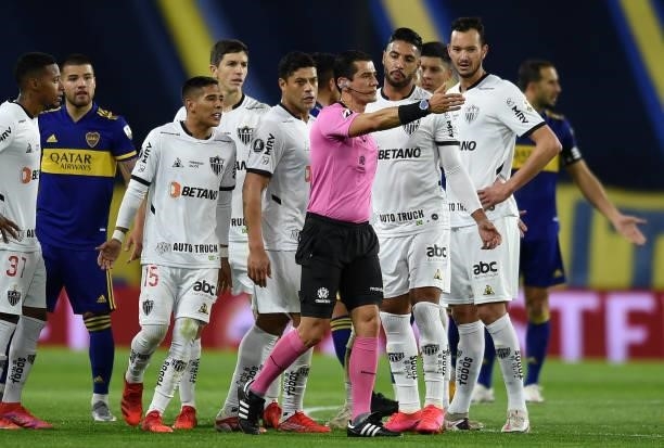Referee Matias Rojas gestures during a round of sixteen match between Boca Juniors and Atletico Mineiro as part of Copa CONMEBOL Libertadores 2021 at...