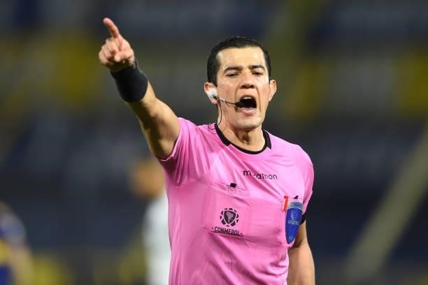 Referee Andrés Rojas gestures during a round of sixteen match between Boca Juniors and Atletico Mineiro as part of Copa CONMEBOL Libertadores 2021 at...