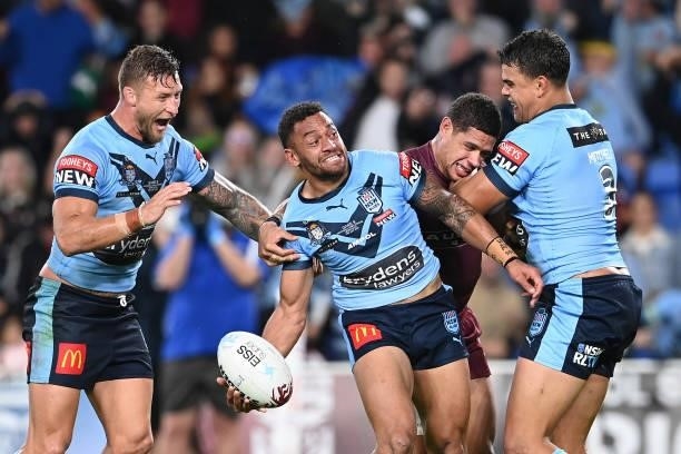 Apisai Koroisau of the Blues celebrates with team mates after scoring a try during game three of the 2021 State of Origin Series between the New...
