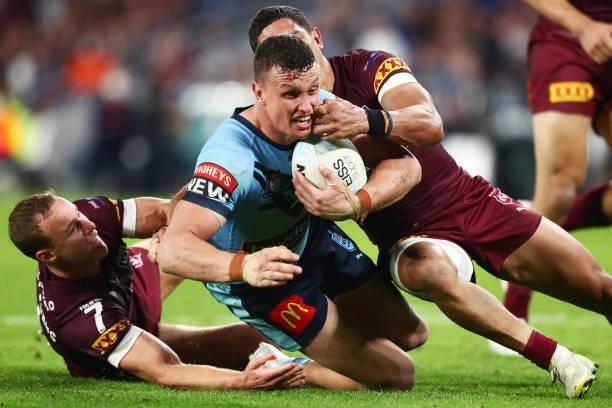 Jack Wighton of the Blues is tackled during game three of the 2021 State of Origin Series between the New South Wales Blues and the Queensland...