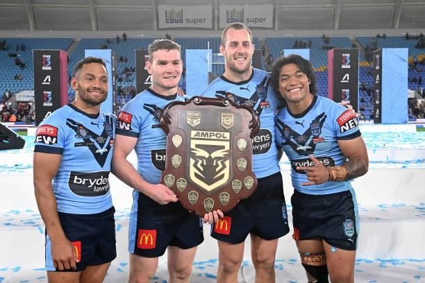 Apisai Koroisau of the Blues, Liam Martin of the Blues, Isaah Yeo of the Blues and Brian To'o of the Blues pose with the trophy after winning the...