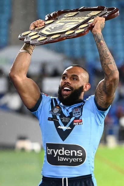 Josh Addo-Carr of the Blues holds aloft the Origin trophy after winning the series 2-1 after game three of the 2021 State of Origin Series between...