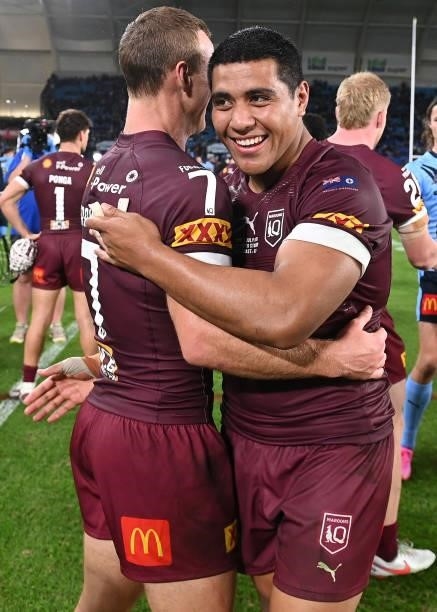 Daly Cherry-Evans of the Maroons and Moeaki Fotuaika of the Maroons celebrate winning game three of the 2021 State of Origin Series between the New...